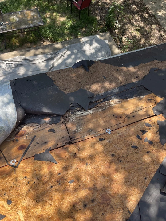 Roof storm damage inspection on an asphalt shingle roof in North Texas