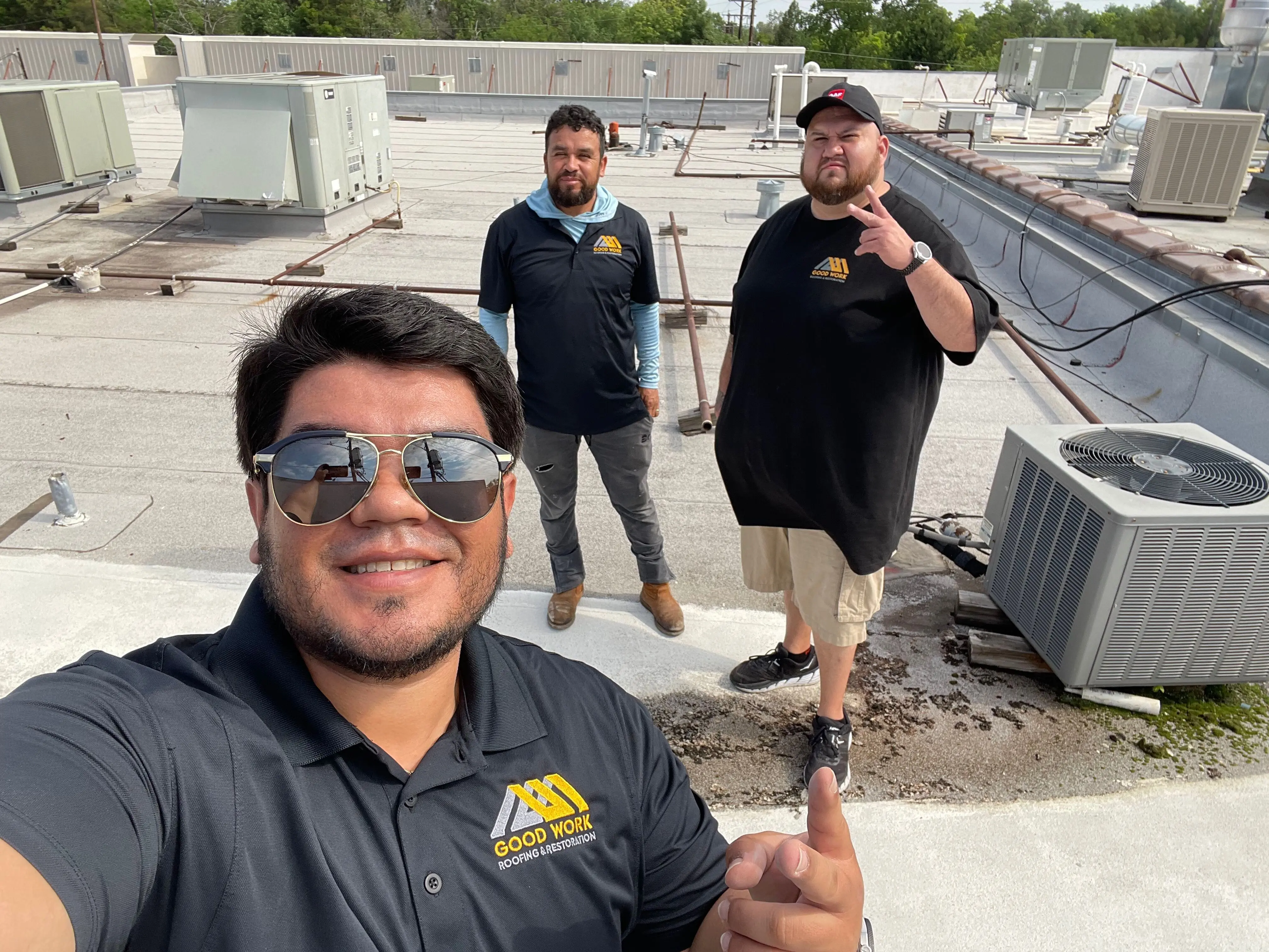 Good Work Roofing team members standing together